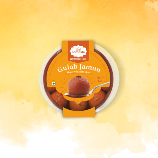 Tub of Namaste Gulab Jamun made with desi ghee, with a sweet lifted on a spoon.